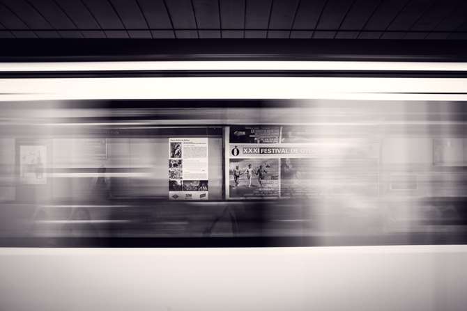 A blurred train speeding by, representing website speed.