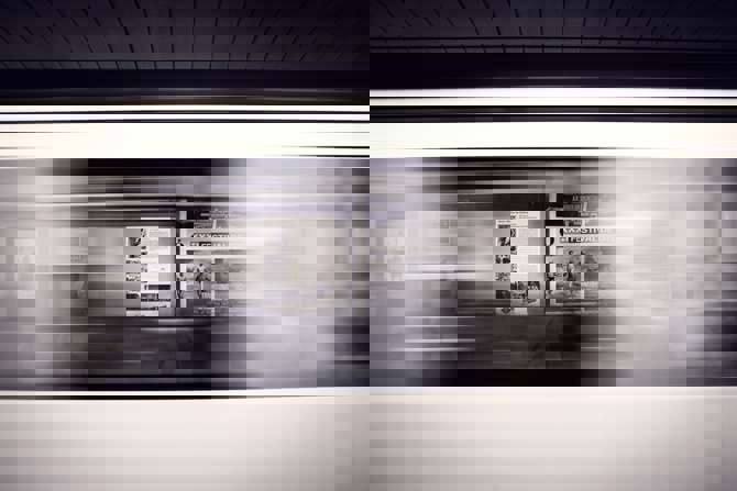 A blurred train speeding by, representing website speed.