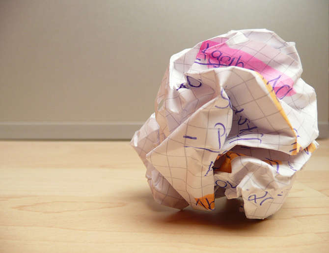 Image of crumpled paper on the floor. Stop writer’s block by brainstorming topics for an editorial calendar. Learn how. Picture by photosteve101 is licensed under CC BY 2.0