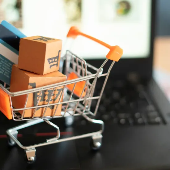 small shopping cart on a laptop