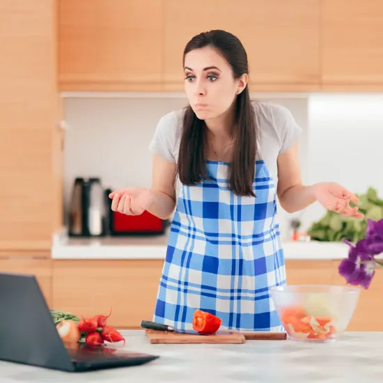 woman shrugging in a kitchen