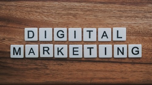 A collection of scrabble tiles spelling "digital marketing" in a post on digital marketing budget allocation.