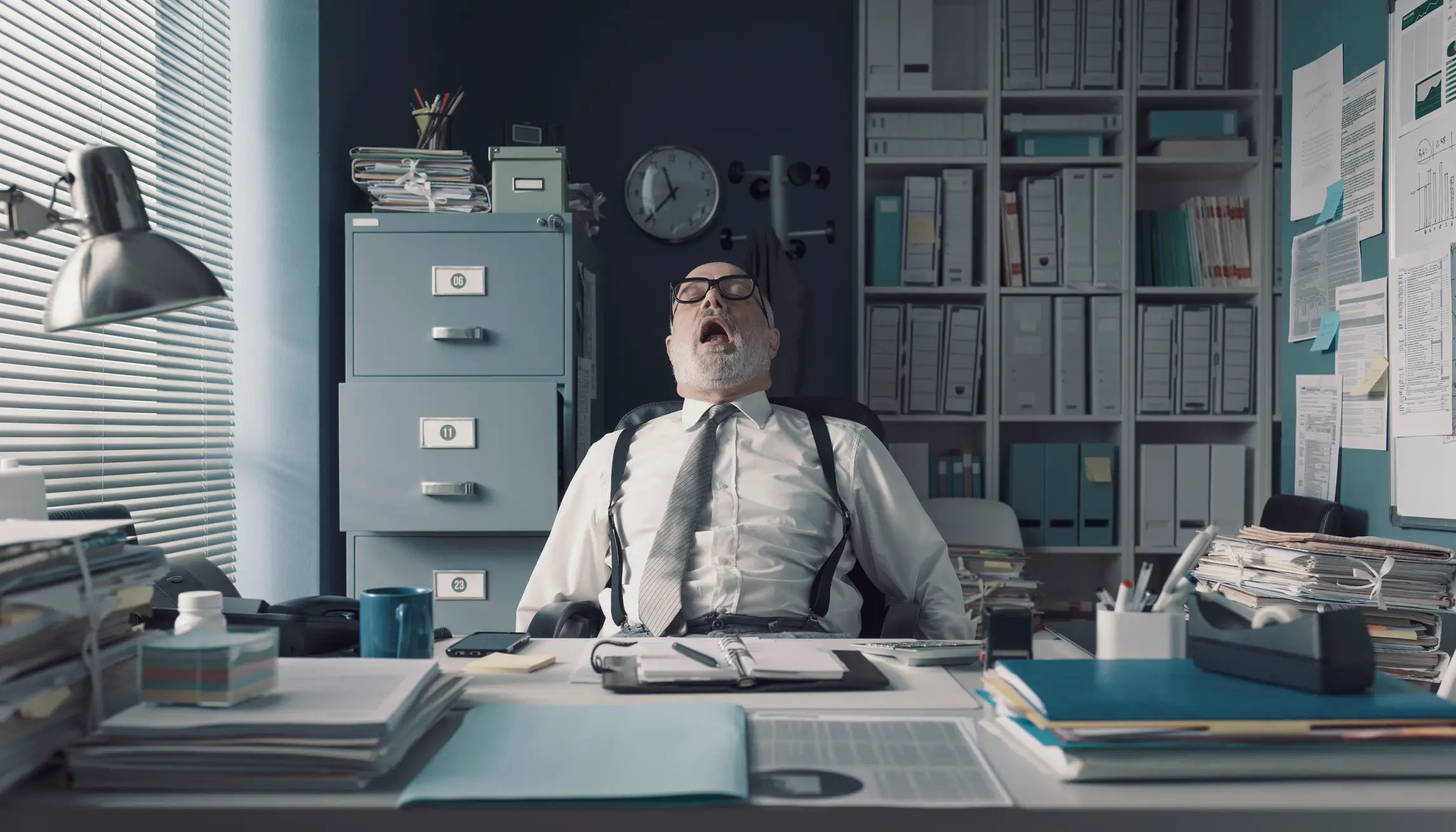 person sleeping at their desk