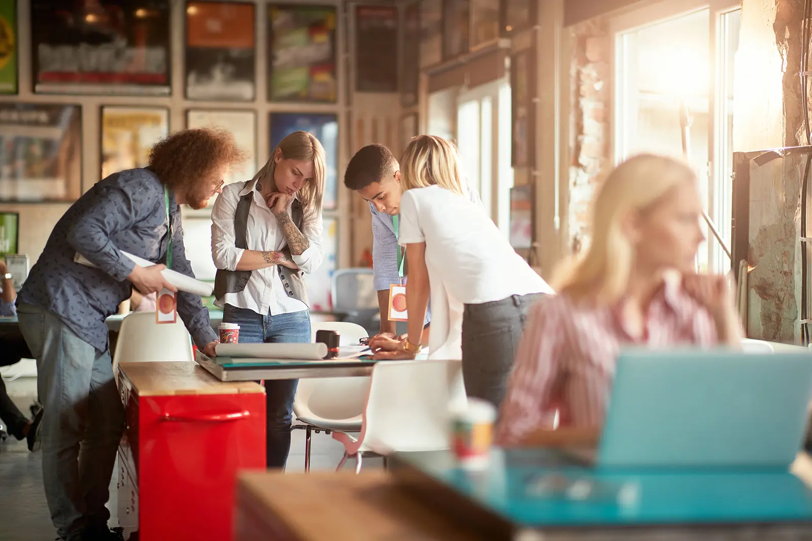 group of people looking at a table