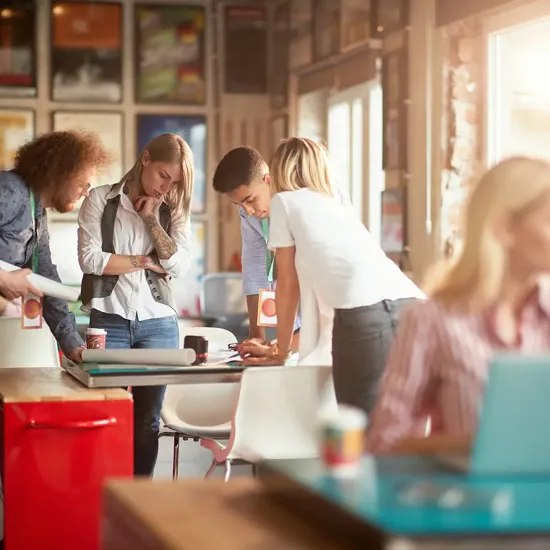 group of people looking at a table