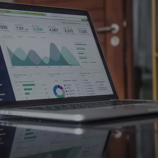 a laptop with statistics data on it