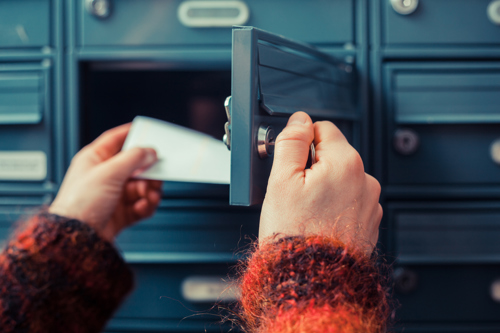 A person delivering a letter.